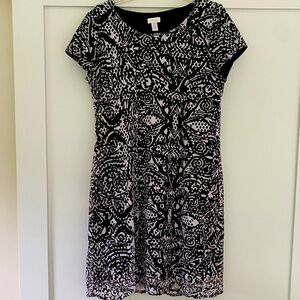Chico’s stretch cut out lined black and white dress.